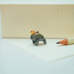 Manatee with a star pendant