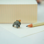 Manatee with a star pendant