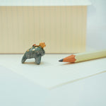 Manatee with a star pendant