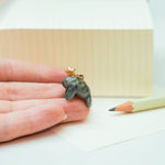 Manatee with a star pendant