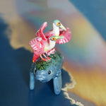 Manatee with roseate spoonbills figurine