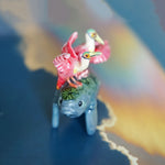 Manatee with roseate spoonbills figurine