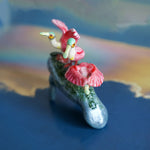 Manatee with roseate spoonbills figurine