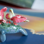 Manatee with roseate spoonbills figurine
