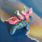 Manatee with roseate spoonbills figurine