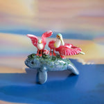 Manatee with roseate spoonbills figurine