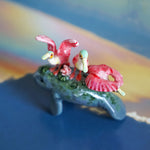 Manatee with roseate spoonbills figurine