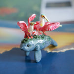 Manatee with roseate spoonbills figurine