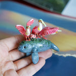 Manatee with roseate spoonbills figurine
