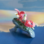Manatee with roseate spoonbills figurine