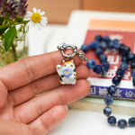 Maneki neko calico with a flower pendant
