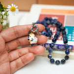 Maneki neko calico with a flower pendant
