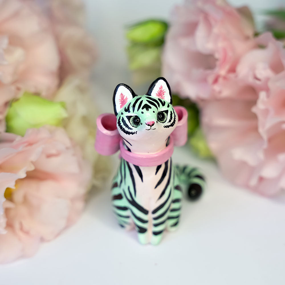 Mint tiger with a pink bow