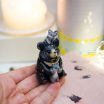 Moon Bear with wolves figurine