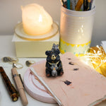 Moon Bear with wolves figurine