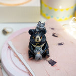 Moon Bear with wolves figurine