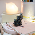 Moon Bear with wolves figurine