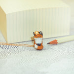 Nodding off fox with a star pendant