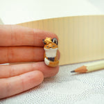 Nodding off fox with a star pendant