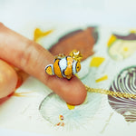 Clown fish with a star pendant