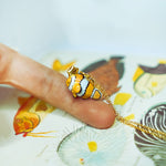 Clown fish with a star pendant