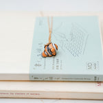 Nemo with a lace pendant