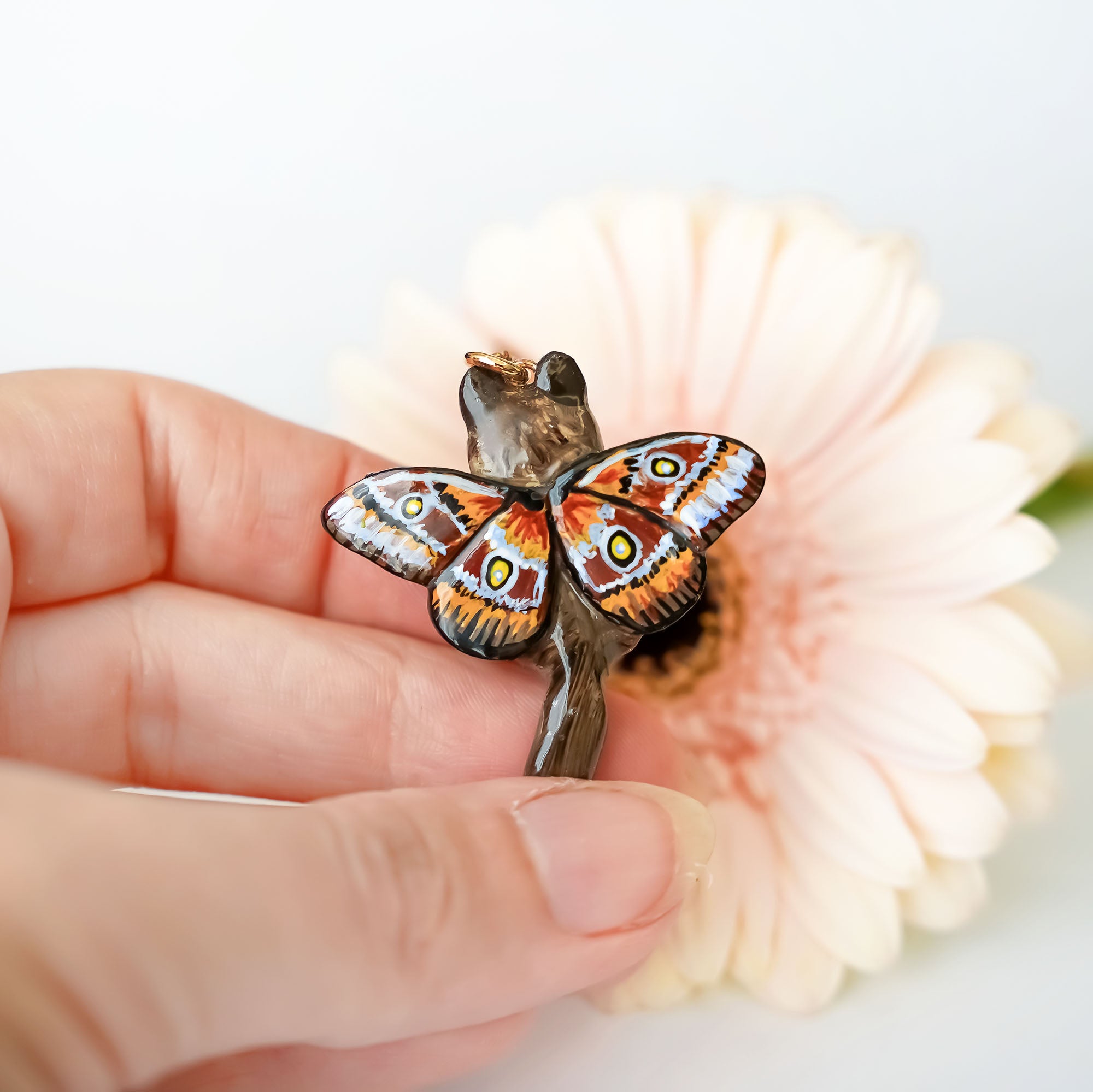 Norwegian forest cat with butterfly wings pendant