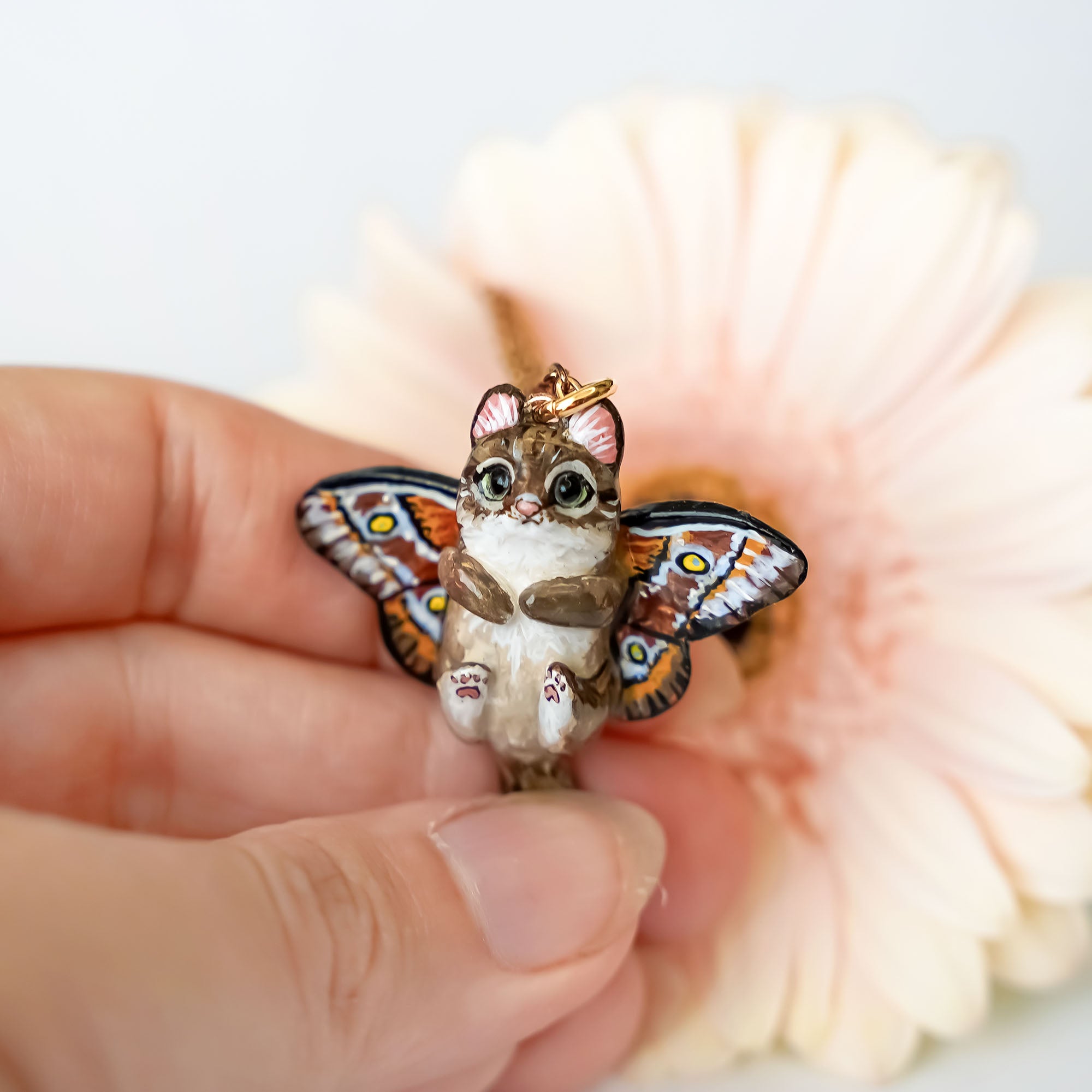 Norwegian forest cat with butterfly wings pendant