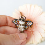 Norwegian forest cat with butterfly wings pendant