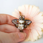Norwegian forest cat with butterfly wings pendant