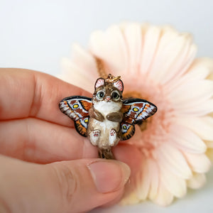 Norwegian forest cat with butterfly wings pendant
