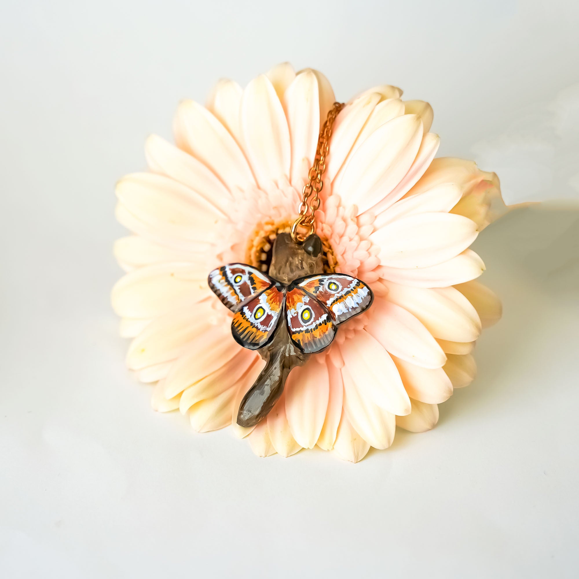 Norwegian forest cat with butterfly wings pendant