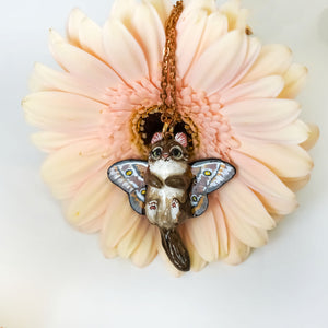 Norwegian forest cat with butterfly wings pendant