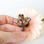 Norwegian forest cat with butterfly wings pendant