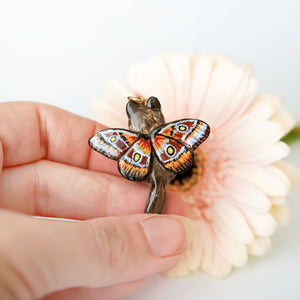 Norwegian forest cat with butterfly wings pendant