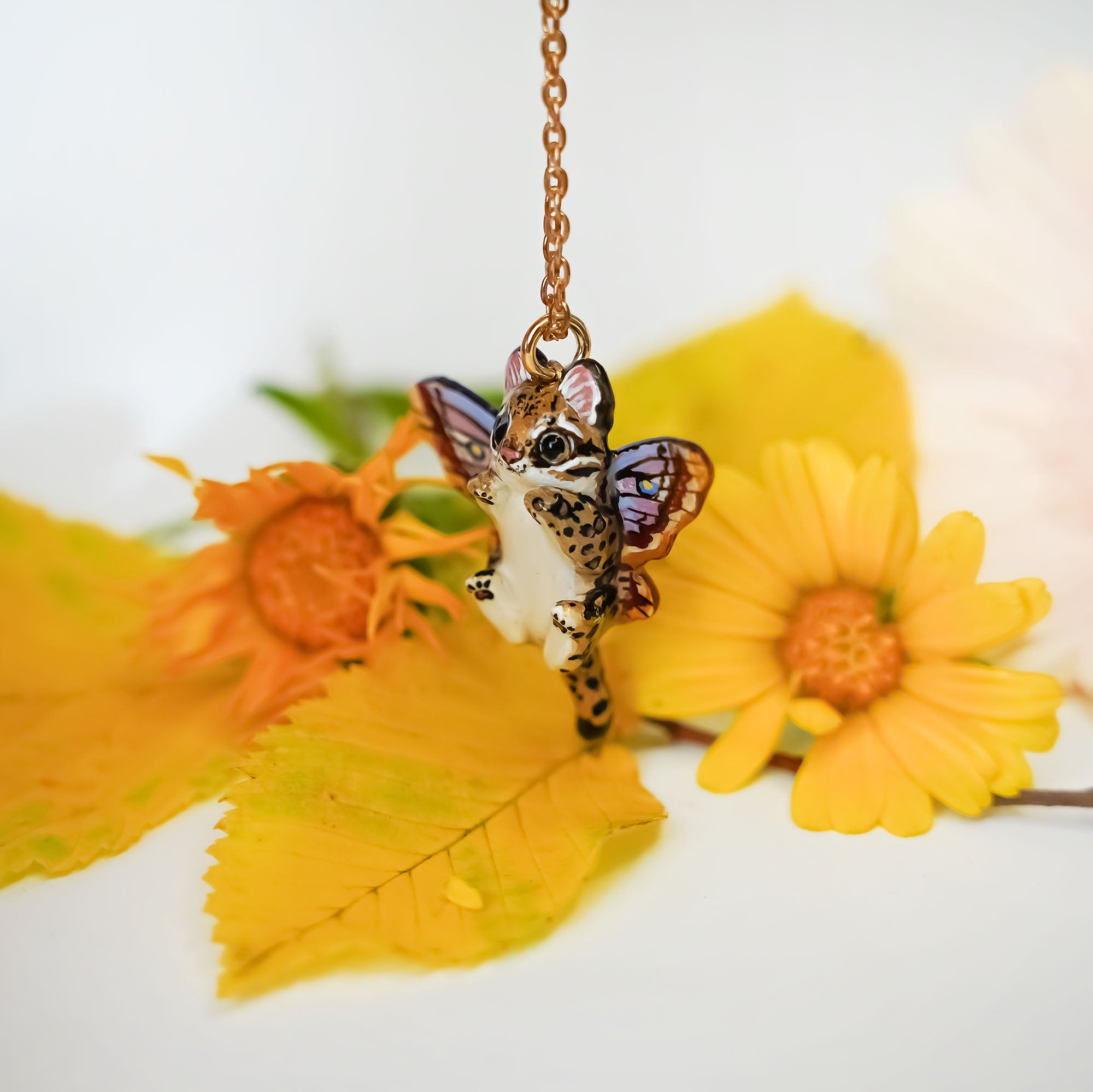 Ocelot with moth wings pendant
