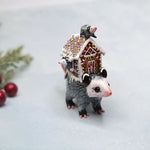 The best opossum mom with gingerbread house