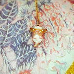 Otter with a star pendant