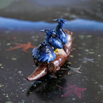 Clawless otter with black herons figurine