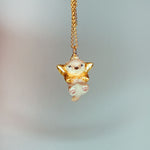 Otter with a star pendant