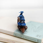 Clawless otter with night herons figurine
