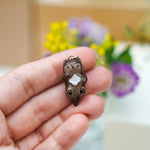 Otter with a mother-of-pearl pendant
