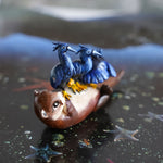 Clawless otter with black herons figurine