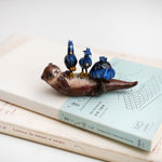 Clawless otter with night herons figurine