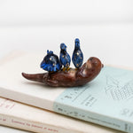 Clawless otter with night herons figurine