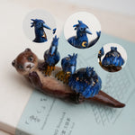 Clawless otter with night herons figurine