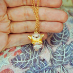 Otter with a star pendant