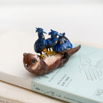 Clawless otter with night herons figurine