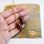 Otter with a silver star pendant