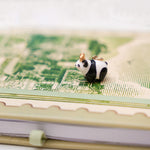 Panda with a gold star pendant